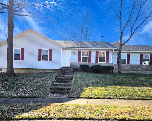 ranch-style home with a front lawn