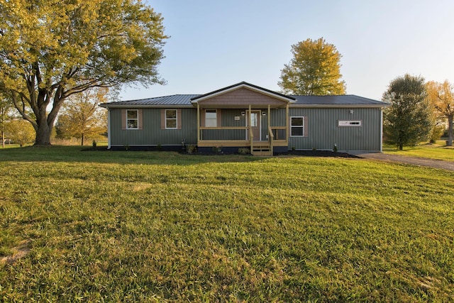 view of front of house featuring a front yard and a porch