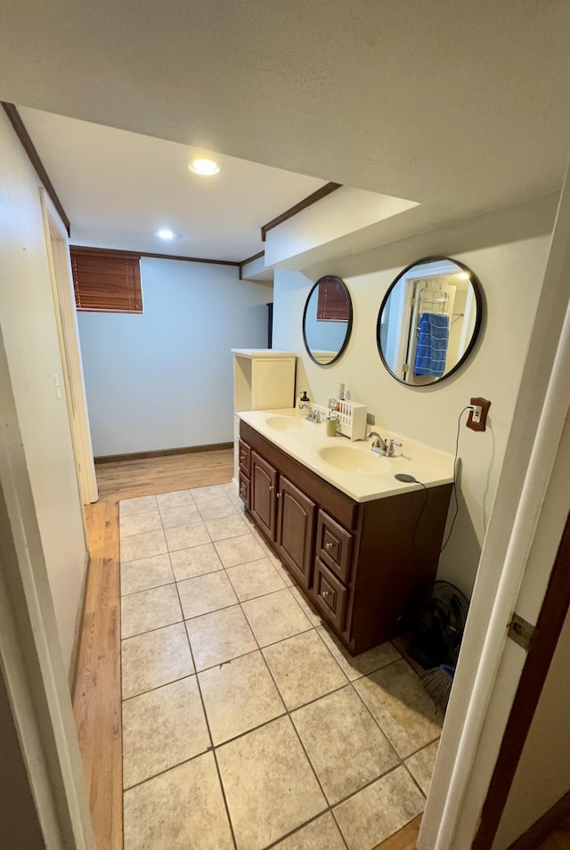 bathroom featuring tile patterned flooring and vanity