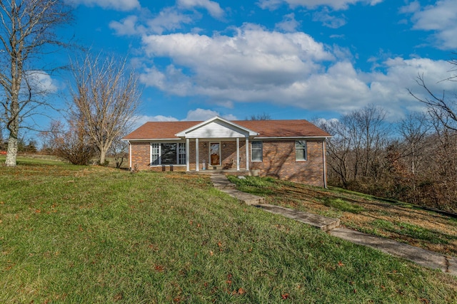 view of front of property with a porch and a front lawn