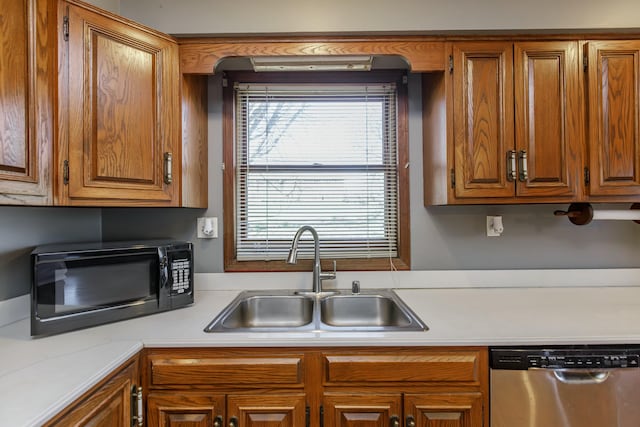 kitchen with stainless steel dishwasher and sink