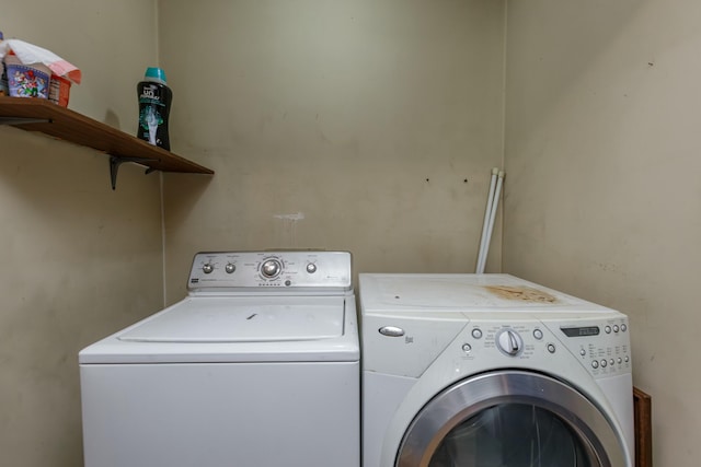 laundry room featuring washing machine and clothes dryer