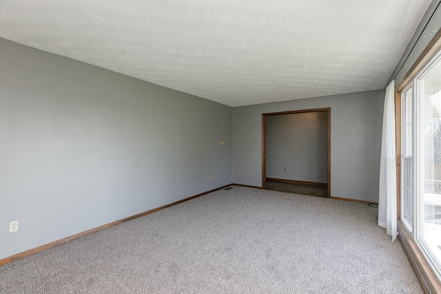 unfurnished bedroom featuring light carpet