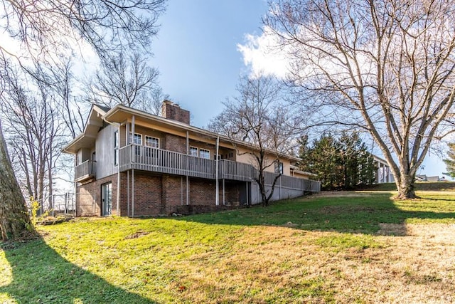 rear view of house with a lawn