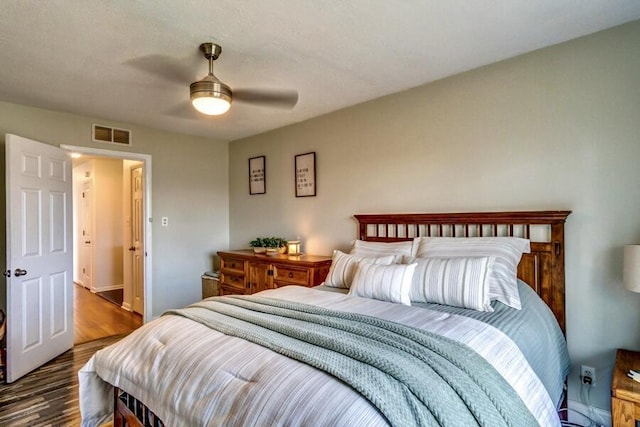 bedroom featuring ceiling fan and dark hardwood / wood-style flooring