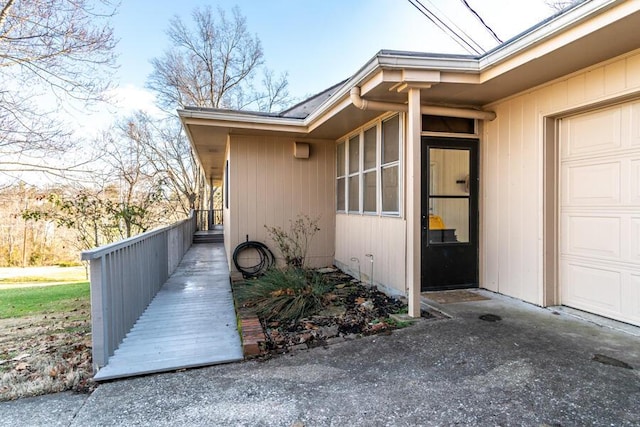 view of side of home featuring a garage