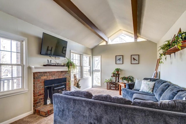 living room featuring a brick fireplace, vaulted ceiling with beams, a healthy amount of sunlight, and carpet flooring