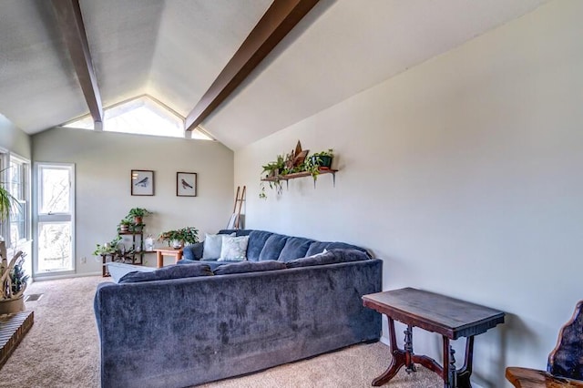 living room with vaulted ceiling with beams and carpet