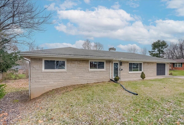 single story home with a front yard and a garage