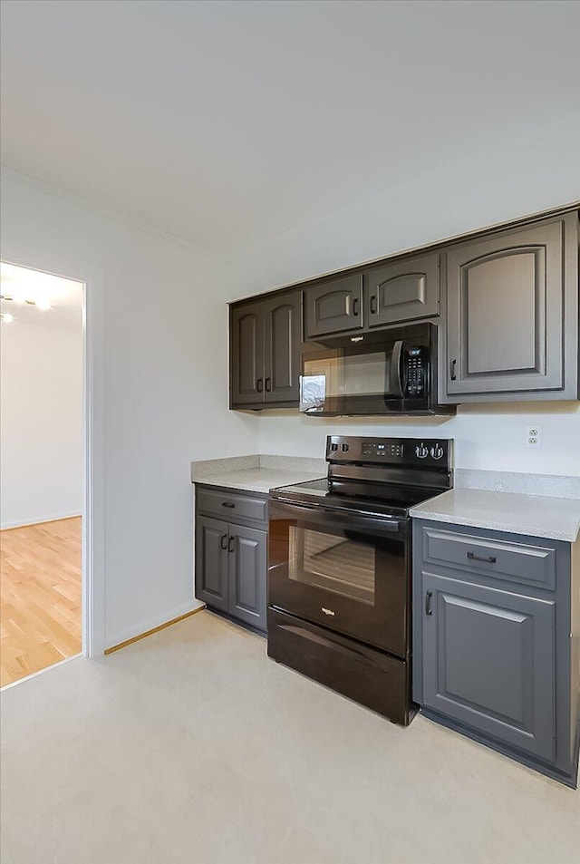 kitchen with gray cabinetry and black appliances