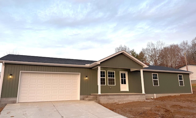 ranch-style house featuring a porch and a garage