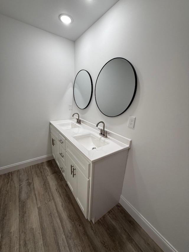 bathroom featuring wood-type flooring and vanity