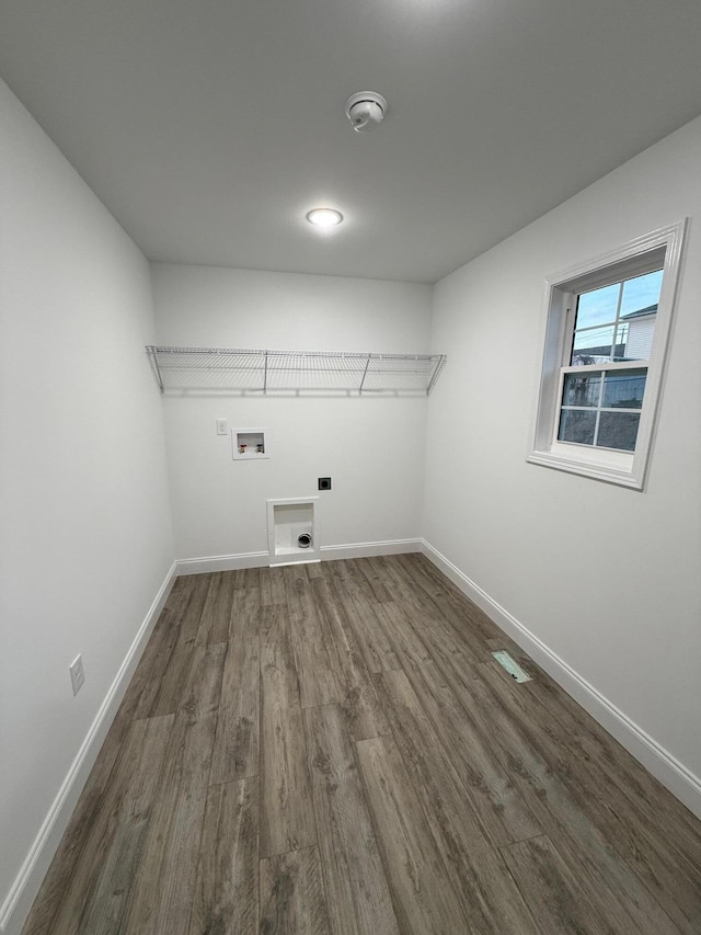 laundry room with washer hookup, dark hardwood / wood-style flooring, and electric dryer hookup