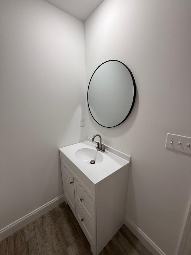 bathroom with vanity and wood-type flooring