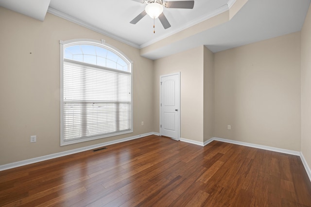 spare room with ornamental molding, dark hardwood / wood-style floors, and ceiling fan