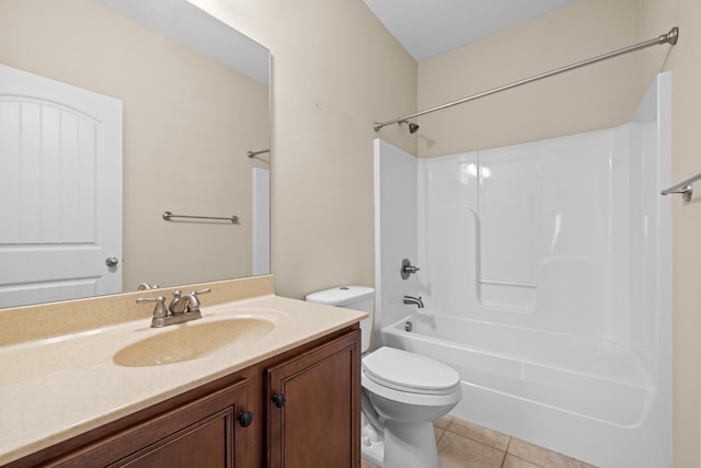 bathroom with vanity, tile patterned floors, toilet, and shower / bathing tub combination