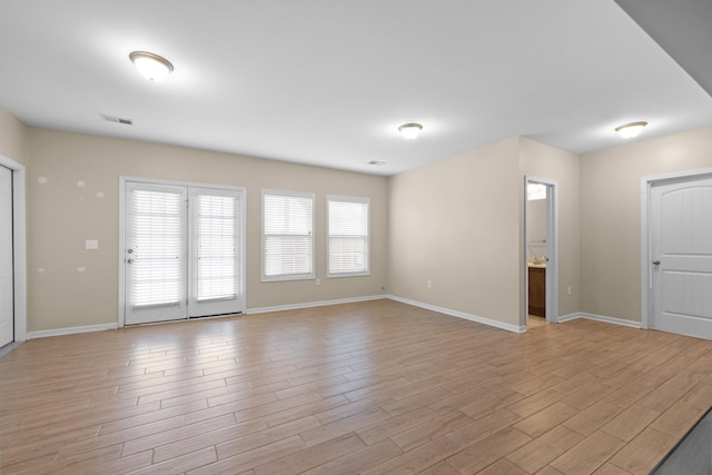 empty room with light wood-type flooring