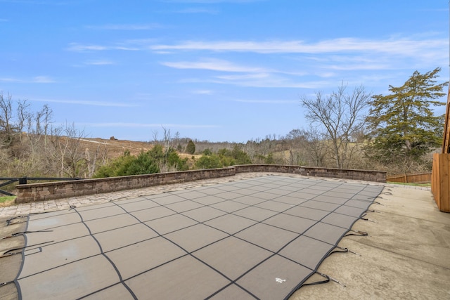 view of patio featuring fence