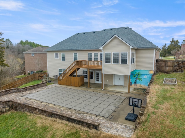 back of house with a deck, a patio, a fenced backyard, french doors, and stairs