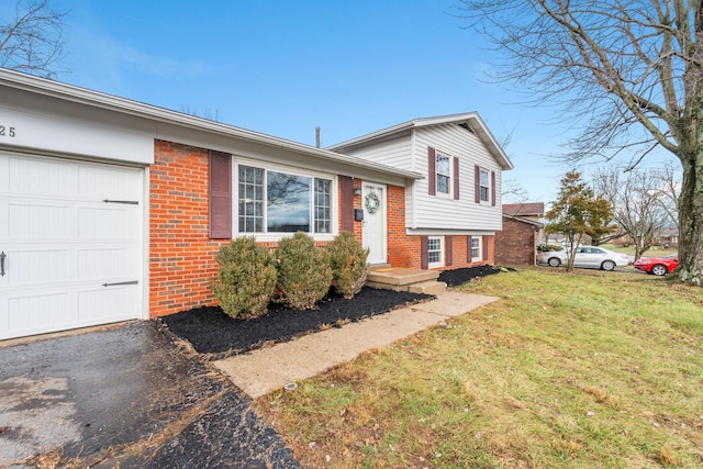 tri-level home with a front lawn