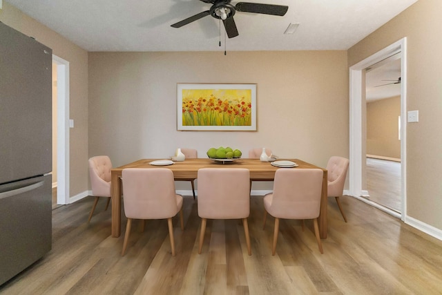 dining area with wood-type flooring