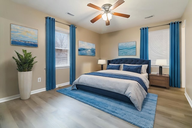 bedroom featuring light hardwood / wood-style flooring and ceiling fan