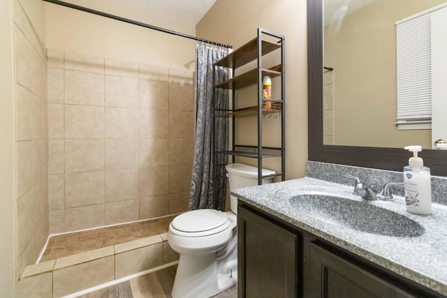 bathroom with a shower with curtain, vanity, hardwood / wood-style flooring, and toilet