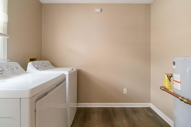 laundry area with water heater, dark hardwood / wood-style flooring, and washer and dryer