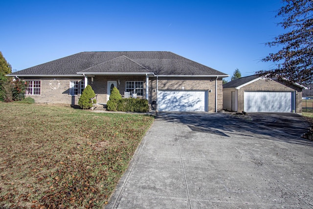 ranch-style home with a front yard and a garage