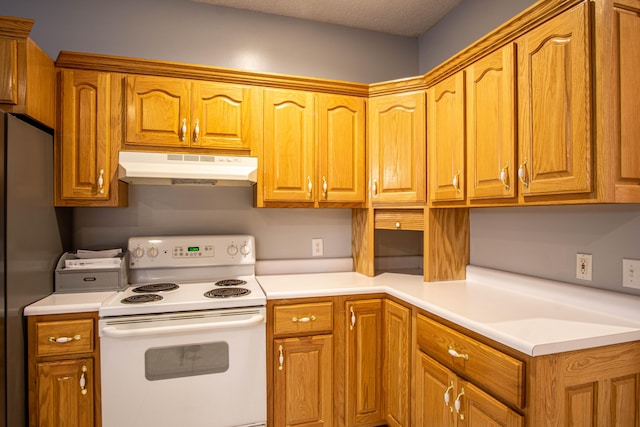 kitchen featuring stainless steel fridge, electric range, and a textured ceiling