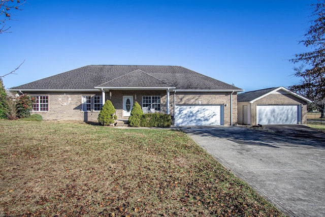 ranch-style house with a garage and a front lawn