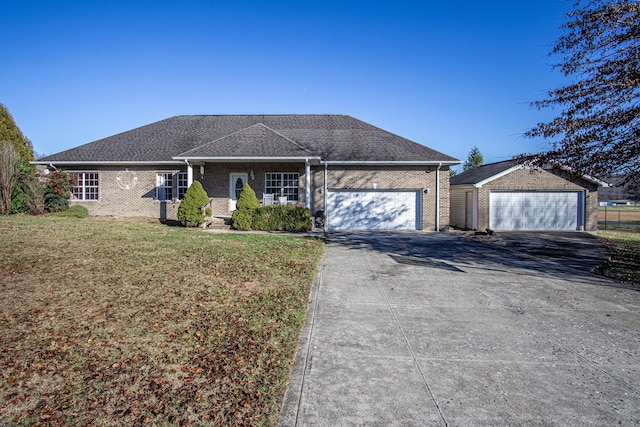 ranch-style house with an outbuilding and a front lawn