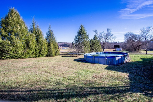 view of yard with a rural view