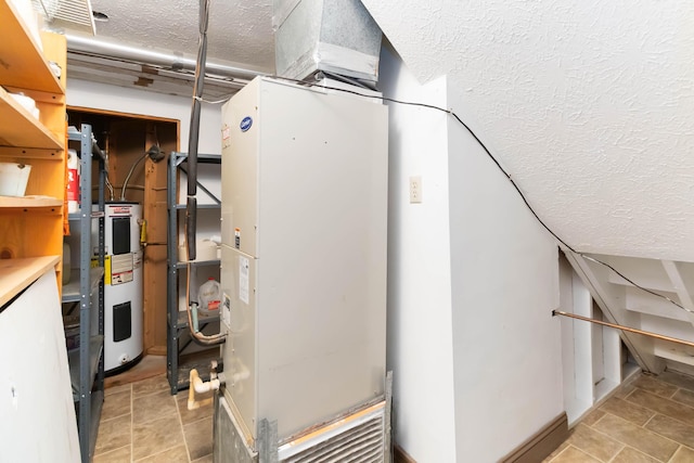 utilities featuring electric water heater and heating unit