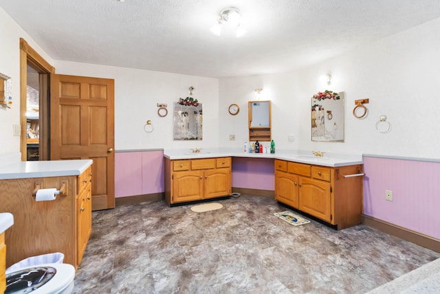 bathroom with vanity and a textured ceiling