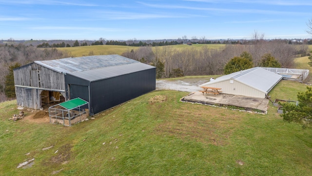 birds eye view of property featuring a rural view