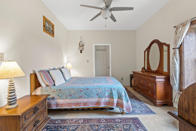 bedroom featuring ceiling fan and light colored carpet