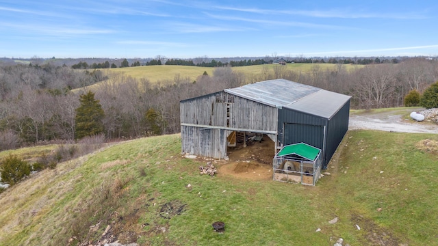 view of outbuilding with a rural view