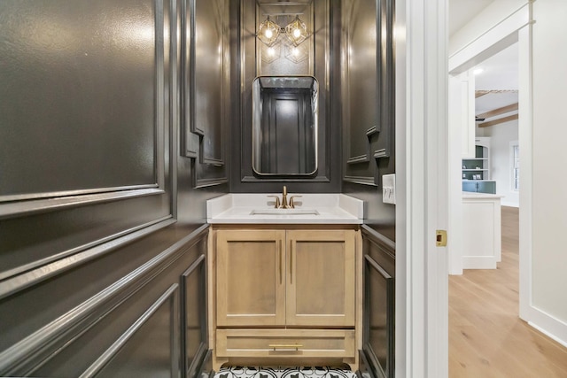 bathroom with vanity and wood-type flooring