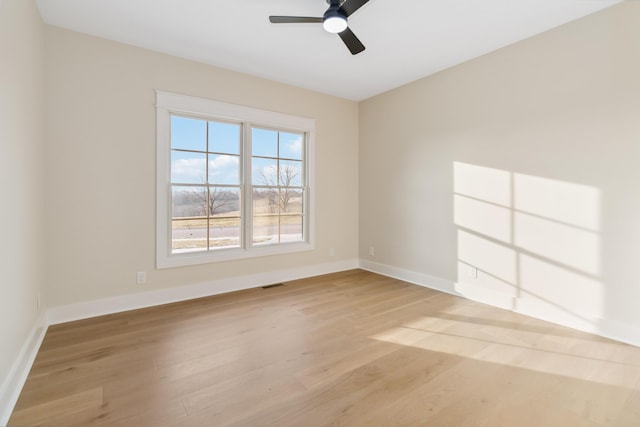 spare room featuring ceiling fan and light hardwood / wood-style floors