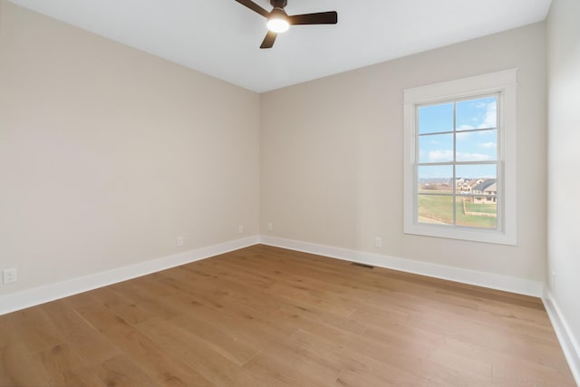 unfurnished room with light hardwood / wood-style flooring and ceiling fan