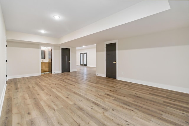 unfurnished room with light wood-type flooring