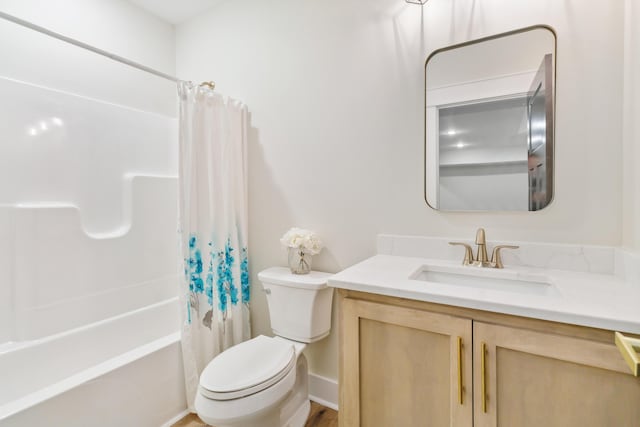 full bathroom with shower / tub combo with curtain, vanity, and toilet