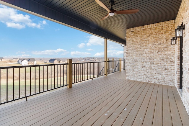 wooden terrace featuring ceiling fan