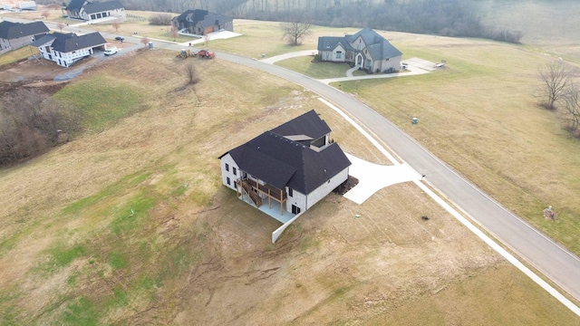 birds eye view of property with a rural view