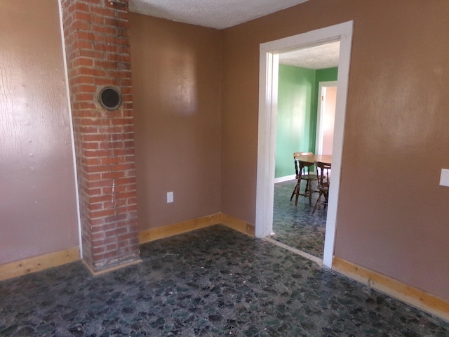 empty room with baseboards