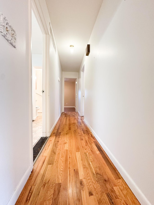 hall with light wood-type flooring