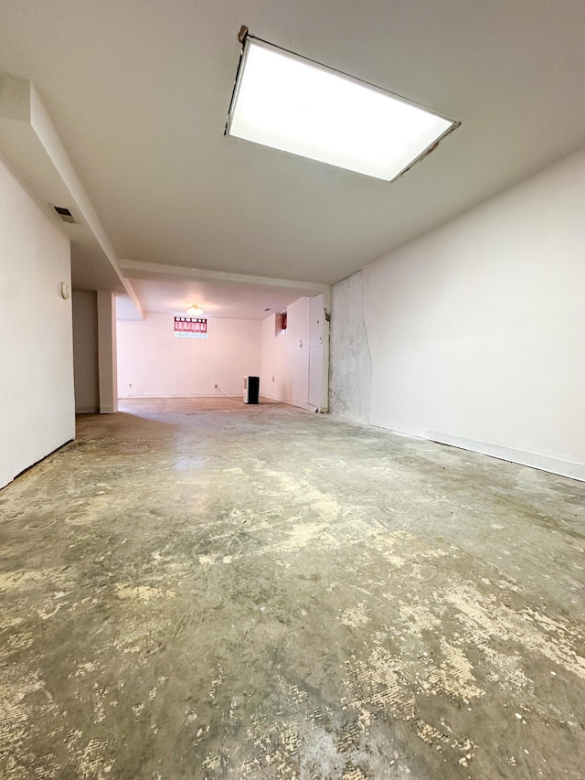 unfurnished room featuring concrete flooring