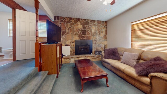 spare room with carpet flooring, ceiling fan, and a textured ceiling