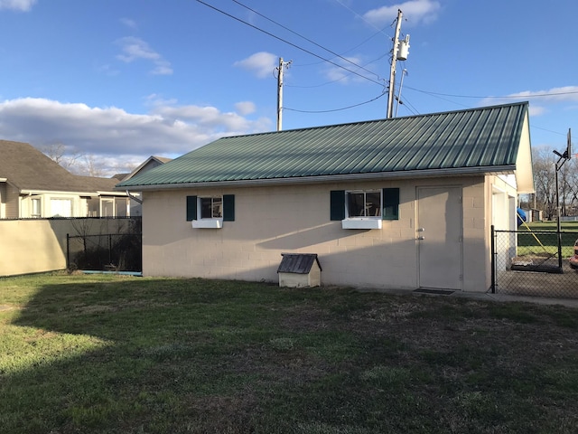 rear view of house with a yard